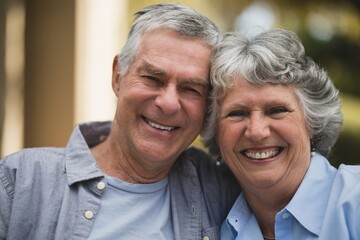 Portrait of senior couple in yard