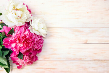 Peonies on a wooden table