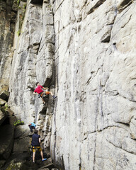 Fototapeta premium A young man climbs in a canyon.