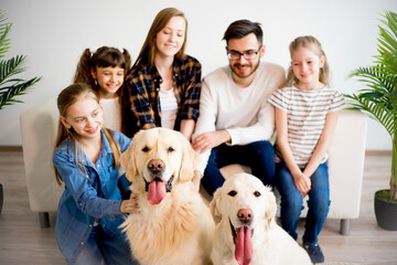 Family playing with a dog