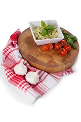 Fettuccine pasta with tomatoes, garlic and napkin cloth