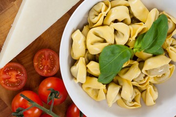 Pasta with herbs, cheese, tomatoes and napkin cloth