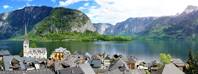 Small austrian town by the lake surrounded with mountains.