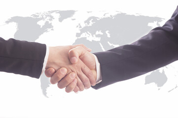 handshake of business partners after signing contract