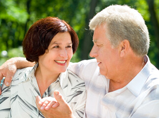 Senior happy couple embracing, outdoors