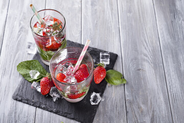 Glasses of lemonade with strawberries
