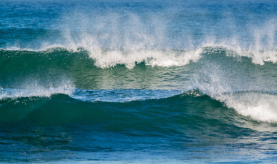 waves breaking in the shore