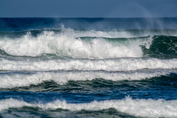 waves breaking in the shore