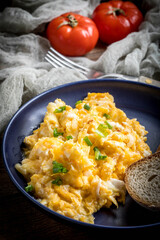 Scrambled eggs with onion and chives.