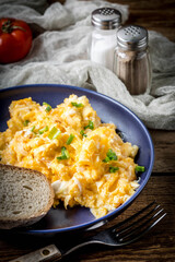 Scrambled eggs with onion and chives.