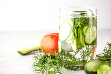 Cold cucumber water in a glass for weight loss. Cleansing the body.