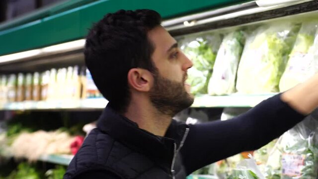 Young Man Shopping at Supermarket