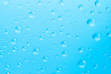 water droplets on blue glass