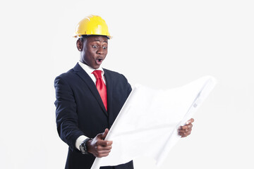 Happy african american construction worker holding blueprint