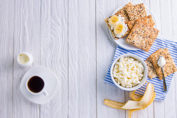 Healthy breakfast including cottage cheese and grainy biscuits