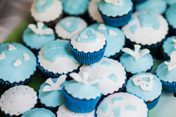 Muffines with blue and white decoration