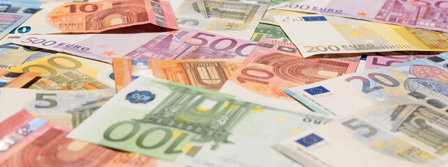 Pile of paper euro banknotes as part of the united country's payment system