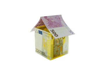 House made from euro bills isolated on white background