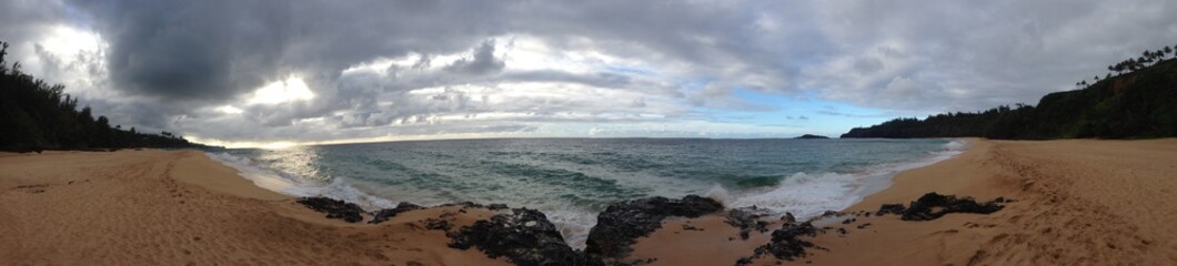 Stormy Tropical Coast with Blue Skies on the Horizon