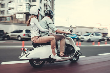 Fototapeta na wymiar Couple on scooter