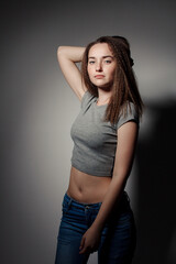 Portrait of young beautiful girl brunette in the Studio