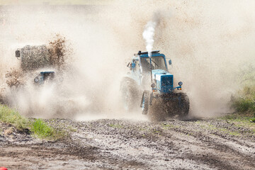 Trucks races on off road terrain. Races without rules on a cross-country terrain. Racing on tractors.