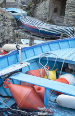 Fototapeta na wymiar blue boats and red bowl in city on the sea in Italy