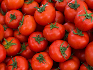 Delicious fresh red tomatoes. Summer market full of organic tomatoes. It can be used as background.