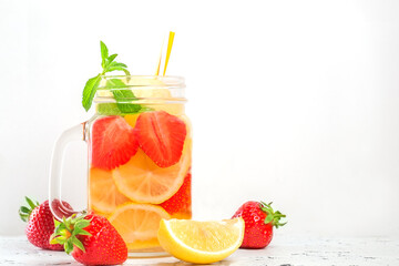 drink with strawberry lemon and mint on white