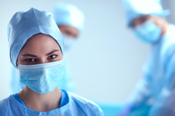 Team surgeon at work in operating room.