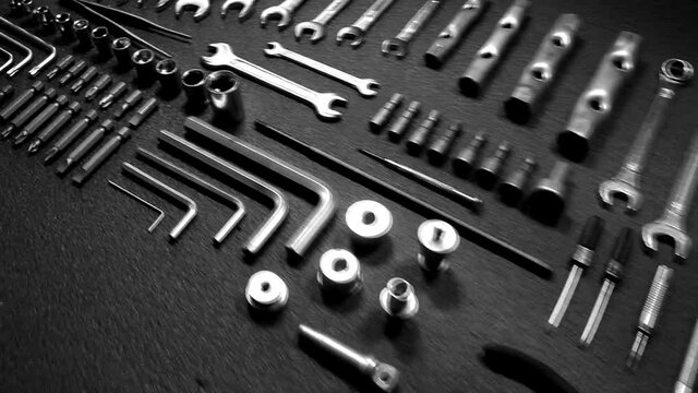 Camera flying over set of steel tools macro shot video 
