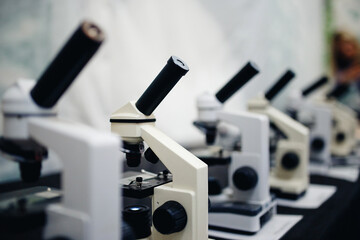 series of microscopes of monochrome color and with a glare. Concept of biology and research medical equipment.