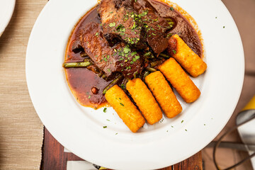 Goulash with rolls on red pepper