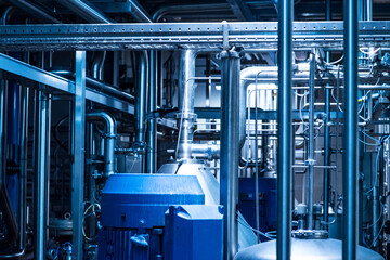 Modern beer plant brewery , with brewing kettles, vessels, tubs and pipes made of stainless steel.