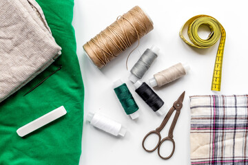 Sewing tools, fabric and kit for hobby collection on white background top view