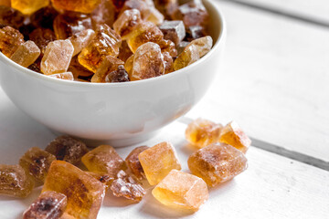 cooking sweets set with different sugar lumps on white table background close up