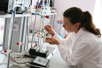 A student girl conducting experiments in chemical laboratory