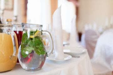 Jugs full of refreshing lime drink on some festive event or catered dinner
