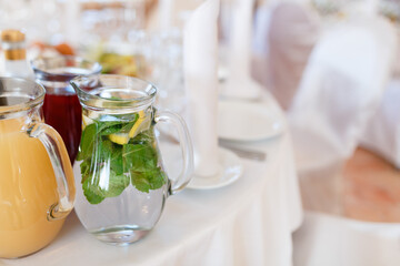 Jugs full of refreshing lime drink on some festive event or catered dinner