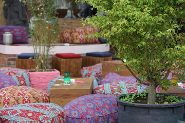 Boho, Bohemian style furniture, colorful poufs. Restaurant garden decor ideas