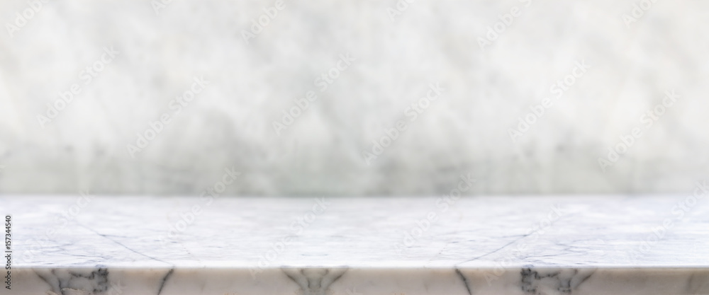 Fototapete Empty white marble table top with blur stone background bokeh light,Mock up template for display or montage of your design,Banner for advertise of product,panorama view