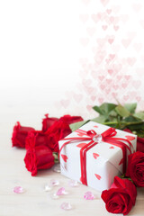 Gift box with hearts. Red roses. White background.