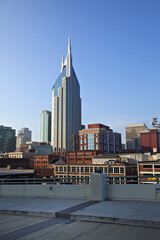 beautiful towering new office building surrounded by older brick buildings in Nashville, Tennessee
