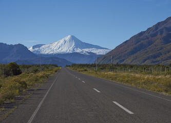 Snow capped peak of Antuco Volcano (2,979 metres) rising above the road to Laguna de Laja National Park in the Bio Bio region of Chile.