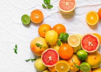 Naklejka na ściany i meble A large assortment of colorful citrus fruit (lemon, lime, orange, grapefruit, mandarin, tangerine, pomelo)