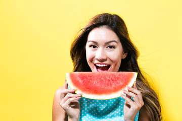  Happy young woman holding watermelon