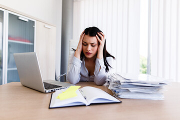 Depressed businesswoman in his office cant get the job done on time