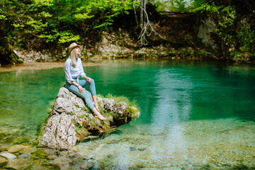 Fototapeta na wymiar woman relax at mountain lake view