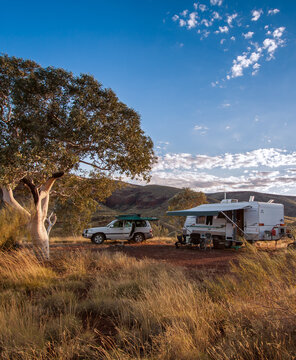 Off Road Caravan And 4WD Camped In The Outback