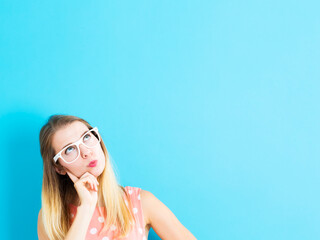 Young woman in a thoughtful pose